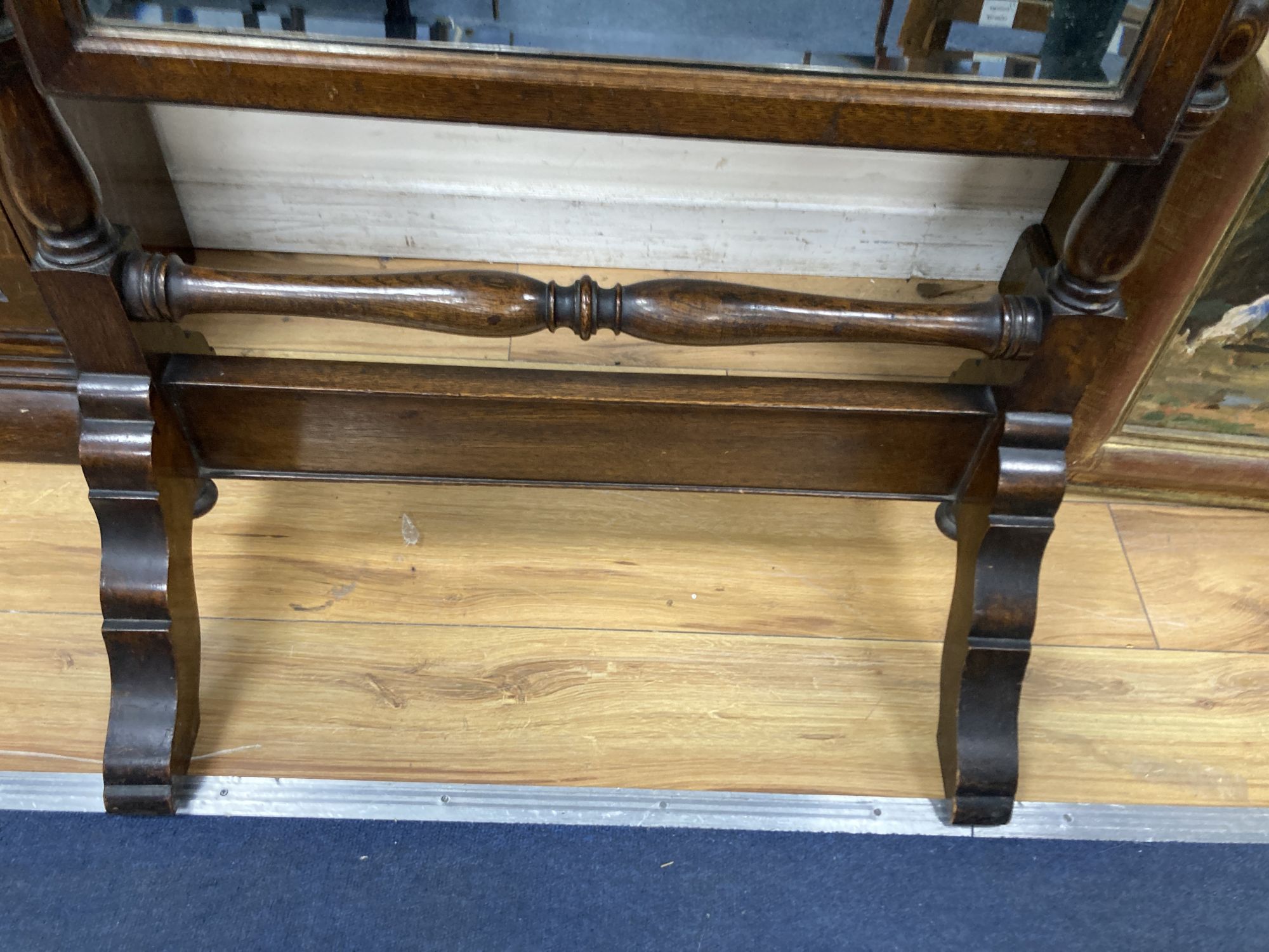 A 1920s oak cheval mirror, width 68cm height 164cm